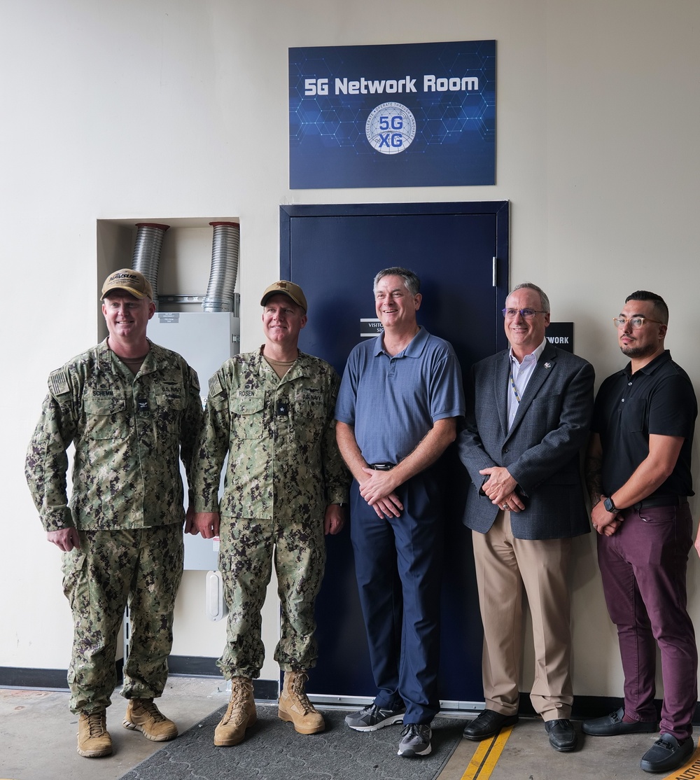 Guests gather for a group photo with Rear. Adm. Bradley Rosen,Commander Navy Region Southwest, after touring Naval Supply Systems Command’s 5G smart warehouse located on Naval Air Station North Island 8 Sept 2022.