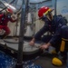 USS Ronald Reagan (CVN 76) Sailors perform damage control training team drill