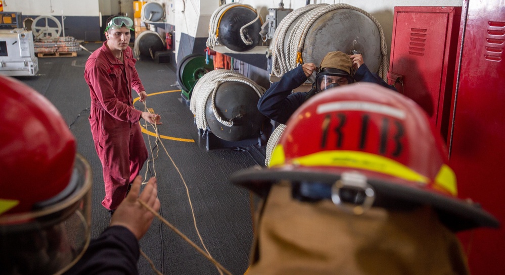 USS Ronald Reagan (CVN 76) Sailors perform damage control training team drill