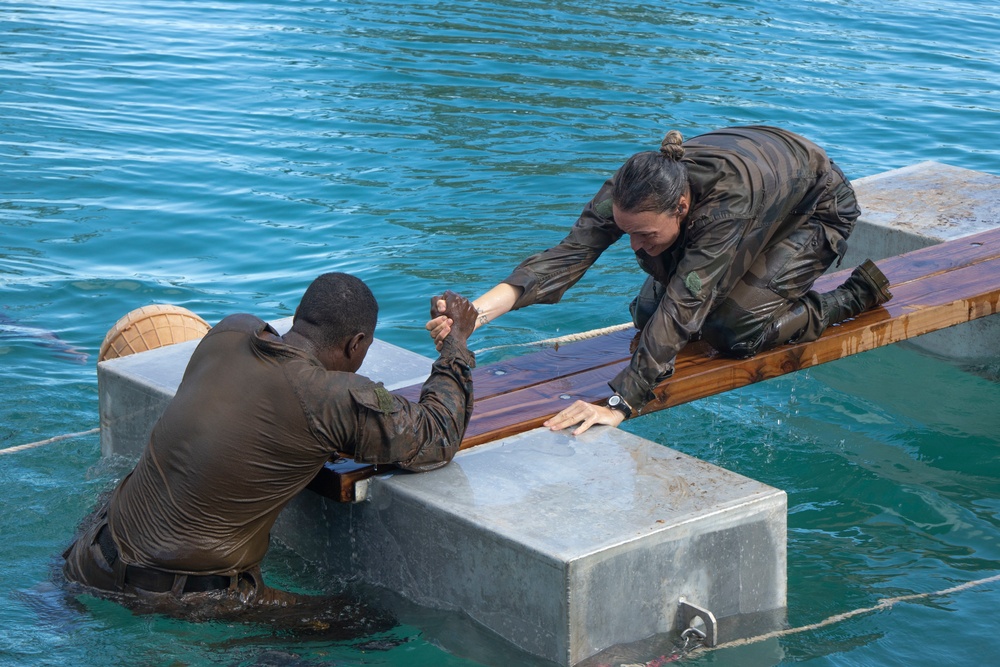 MARFORPAC Marines participate in Water Parkour Course during the French Armed Forces Aito Course