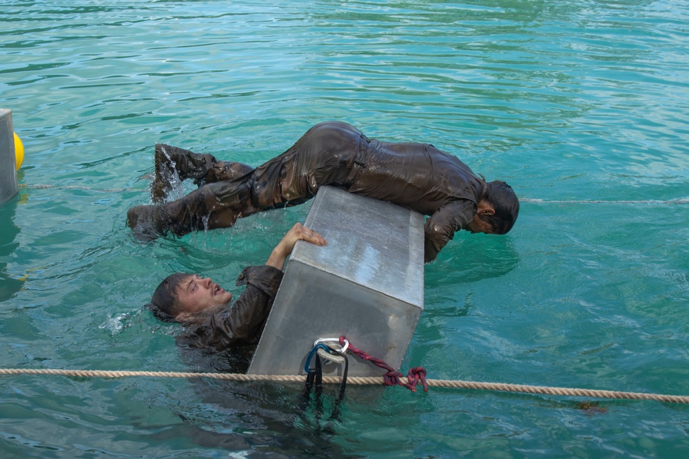 MARFORPAC Marines participate in Water Parkour Course during the French Armed Forces Aito Course