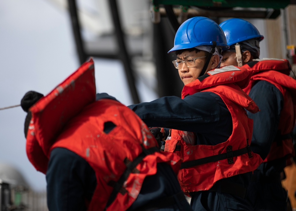 USS Tripoli conducts replenishment-at-sea with USNS Carl Brashear