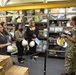 Lt. Jg. Lavetta Ryles gives tour of the USS Carl Vinson stock rooms to NAVSUP FLC San Diego GDSC employees on Sept. 14.