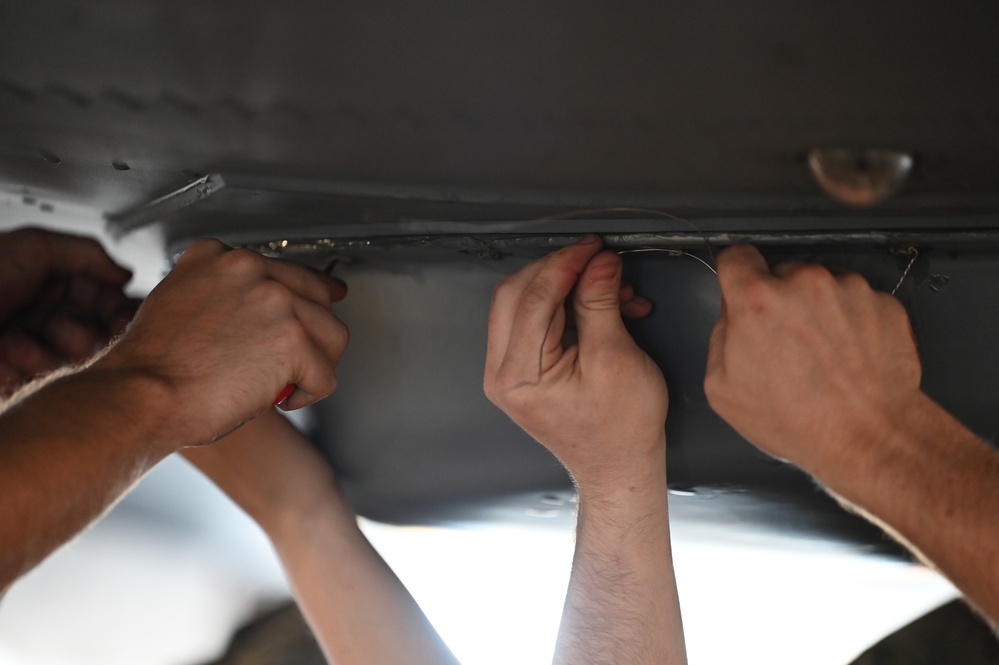 Airmen Perform Maintenance During an ISO Inspection