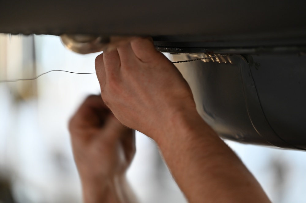 Airmen Perform Maintenance During an ISO Inspection