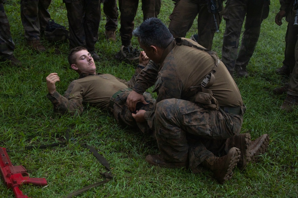 MARFORPAC Marines participate in combat casualty course during the French Armed Forces Aito Course