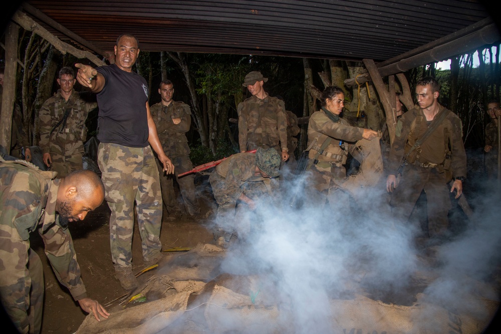 MARFORPAC Marines prepare traditional Polynesian meal during the French Armed Forces Aito Course