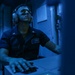 Sailors Stand Watch In Sonar Control Room On Board USS Higgins