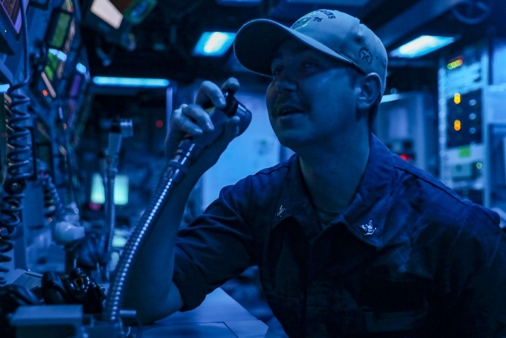 Sailors Stand Watch In Sonar Control Room On Board USS Higgins