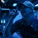 Sailors Stand Watch In Sonar Control Room On Board USS Higgins