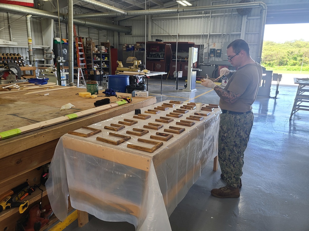 Seabees build a command photo board