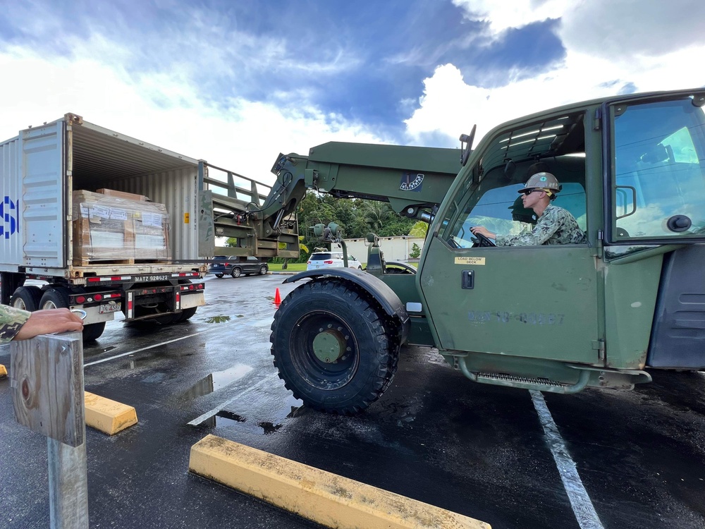 Seabees unload supplies for Mobile Diving and Salvage Unit One