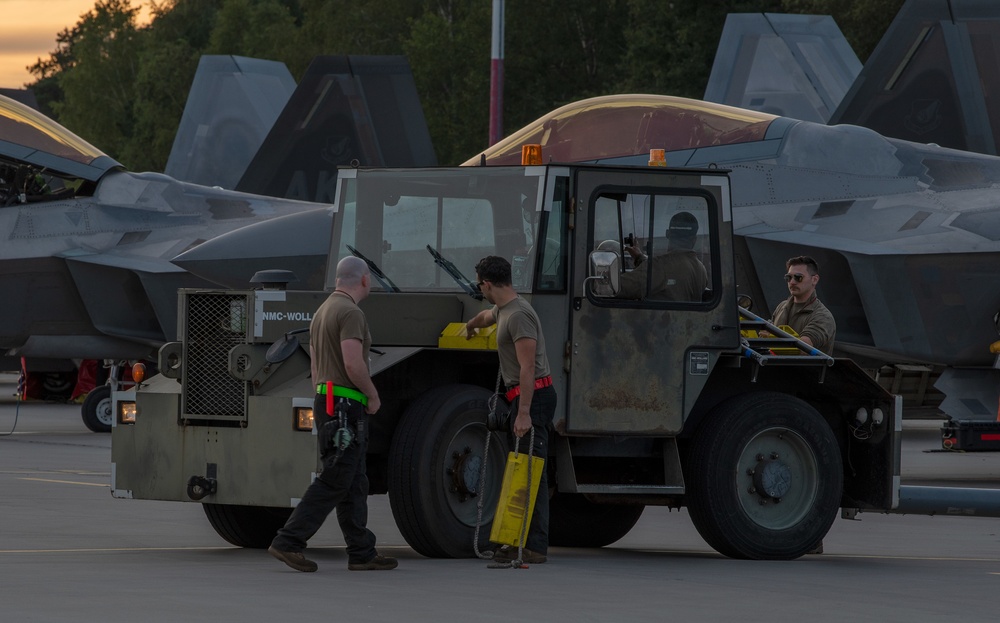 90th AMXS tow F-22 for maintenance