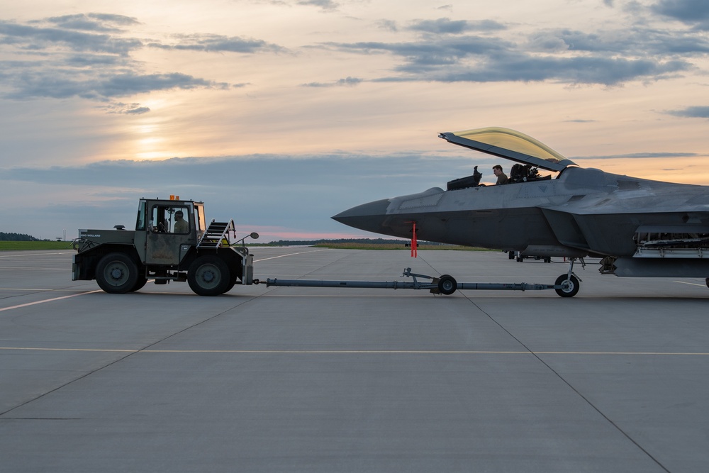 90th AMXS tow F-22 for maintenance