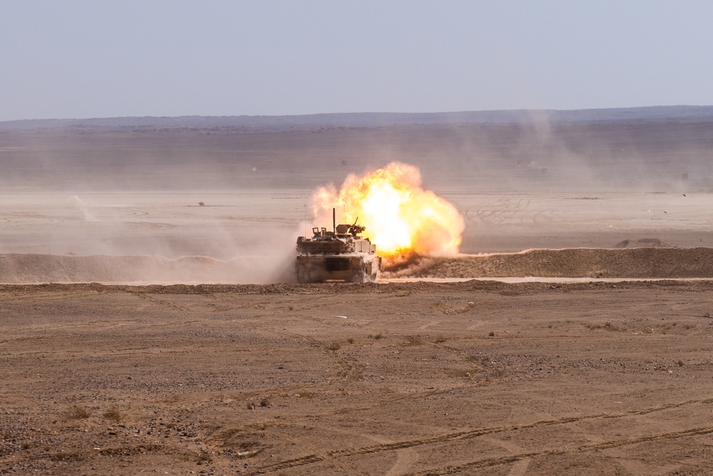 M1 Abrams Tank fires a round down range