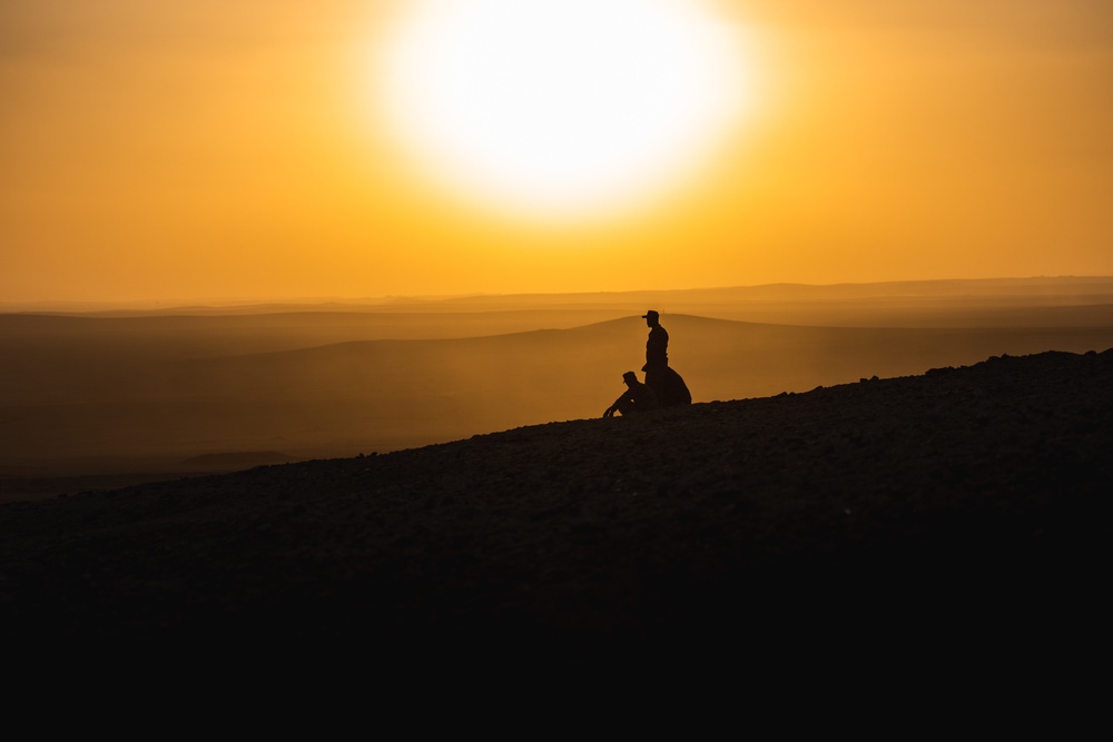 Soldiers watch the sunrise