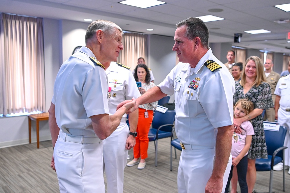 Rear Adm. Lorin Selby welcomes new NavalX Director Capt. Casey Plew