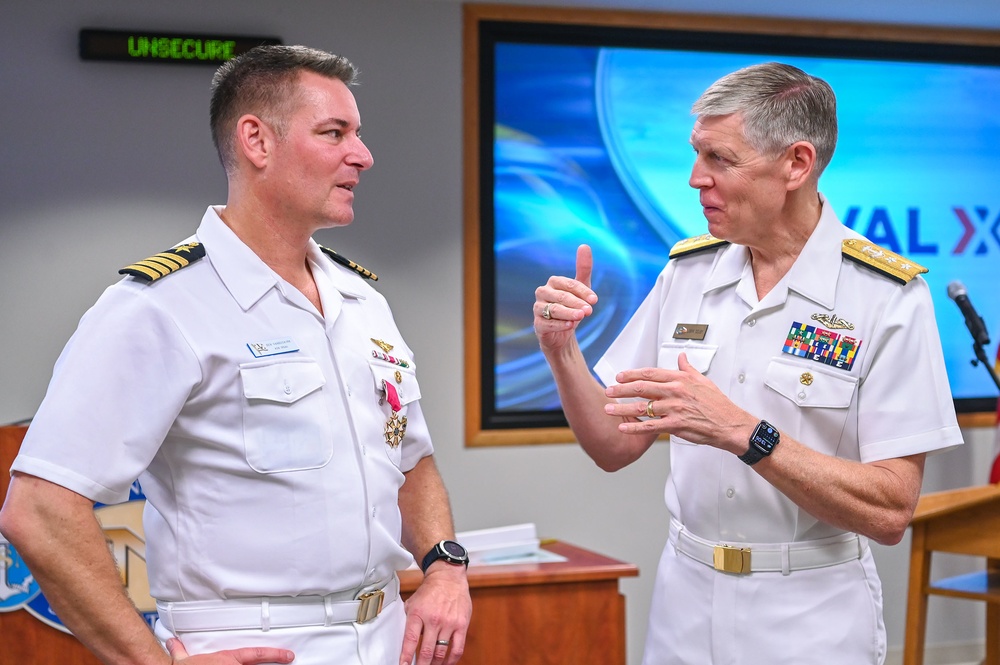 Rear Adm. Lorin Selby and departing NavalX director Capt. Benjamin Van Buskirk at Navalx change of office