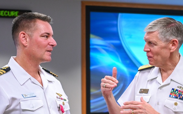 Rear Adm. Lorin Selby and departing NavalX director Capt. Benjamin Van Buskirk at Navalx change of office