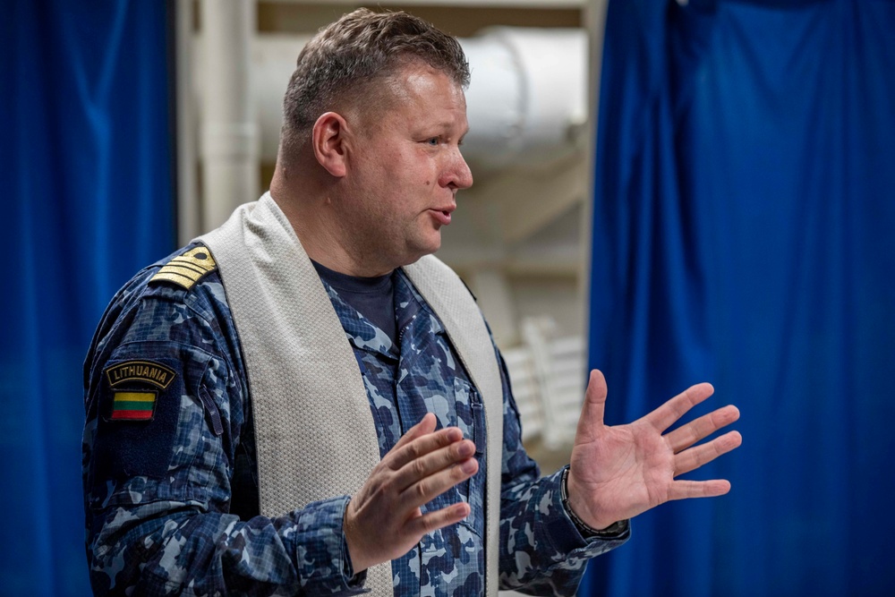 Lithuanian Navy chaplain conducts religious service aboard USS Arlington
