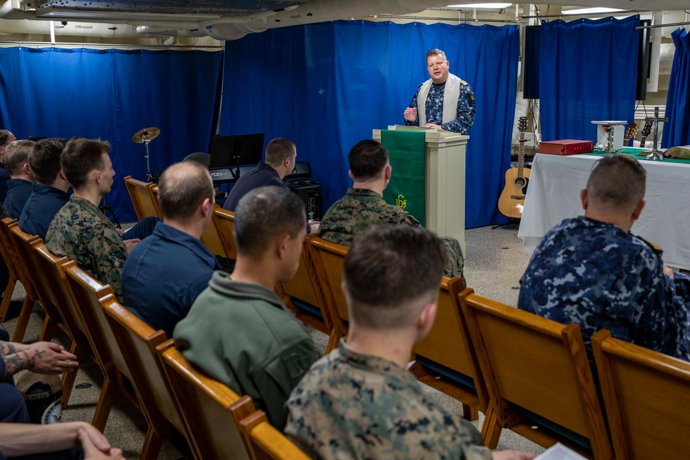 Lithuanian Navy chaplain conducts religious service aboard USS Arlington