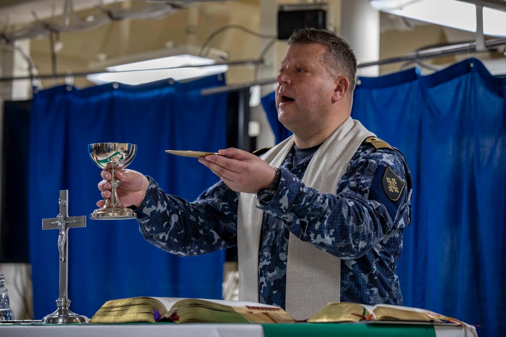 Lithuanian Navy chaplain conducts religious service aboard USS Arlington