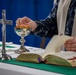 Lithuanian Navy chaplain conducts religious service aboard USS Arlington