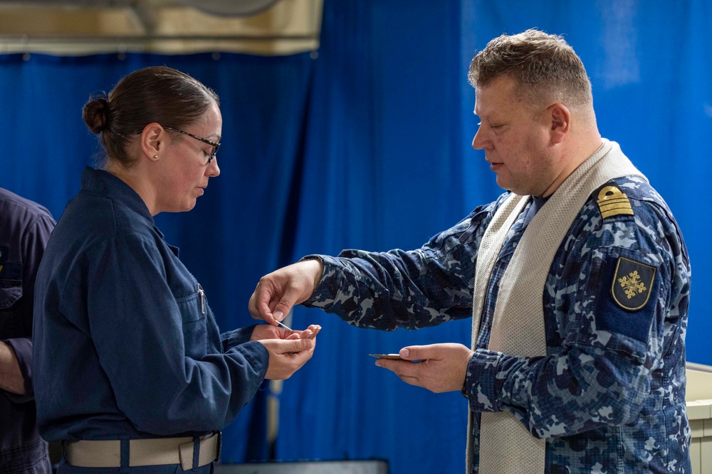 Lithuanian Navy chaplain conducts religious service aboard USS Arlington