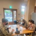 Naval Mobile Construction Battalion 4, volunteer their time to teach basic English lessons during a cultural exchange event with local students.