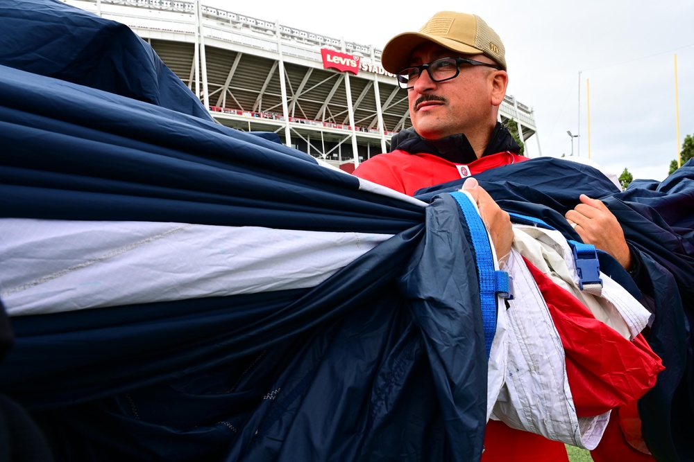 Airmen support San Francisco 49ers’ pre-game flag unfurling