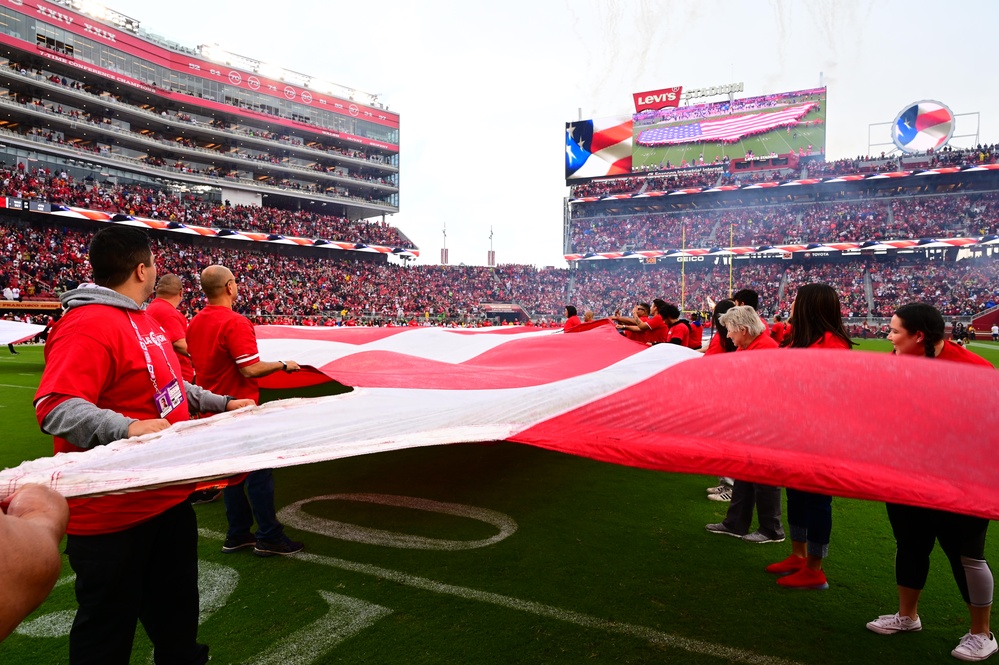 Airmen support San Francisco 49ers’ pre-game flag unfurling