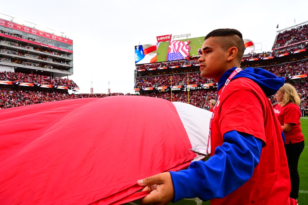 Airmen support San Francisco 49ers’ pre-game flag unfurling