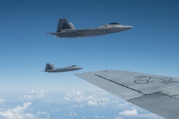 Symbolic F-22 flight marks 154th Wing change of command