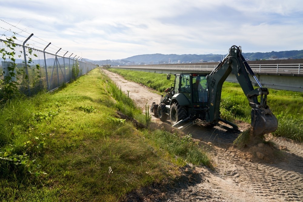 Naval Mobile Construction Battalion 4, Marines with 9th Engineer Support Battalion conduct road construction in Iwakuni.