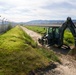 Naval Mobile Construction Battalion 4, Marines with 9th Engineer Support Battalion conduct road construction in Iwakuni.