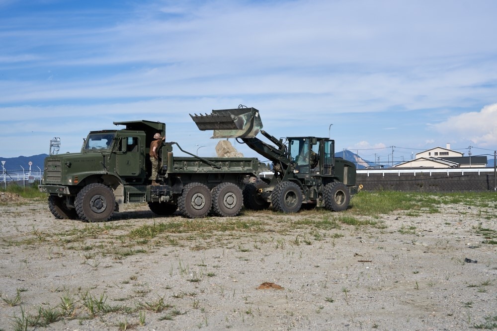 Naval Mobile Construction Battalion 4 removes debris from fence lines.