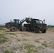 Naval Mobile Construction Battalion 4 and Marines conduct waste relocation.