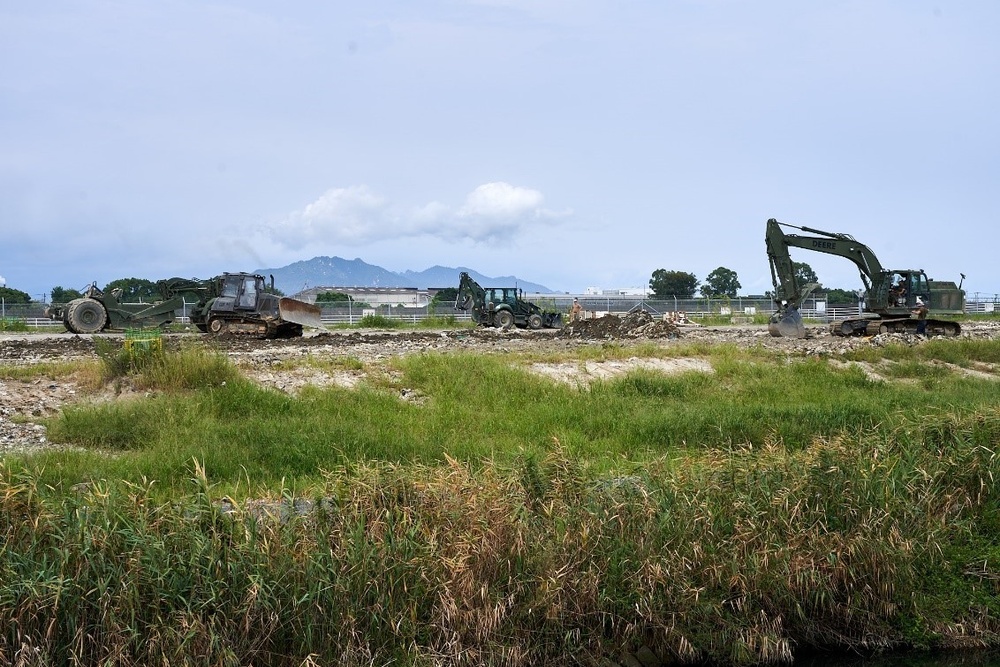 Naval Mobile Construction Battalion 4 conduct grading and leveling operations.