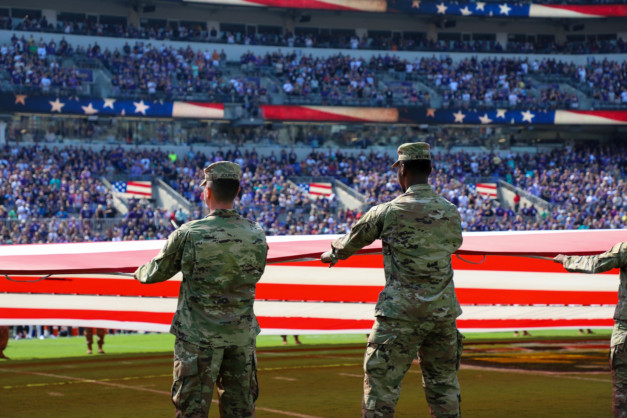 Maryland National Guard soldiers and airmen participate in the pre-game  ceremony for the Baltimore Ravens against the Miami Dolphins game at M&T  Bank Stadium in Baltimore, Md., Sept. 18, 2022. The pre-game