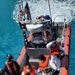 Coast Guard crew transfers people to the Bahamas