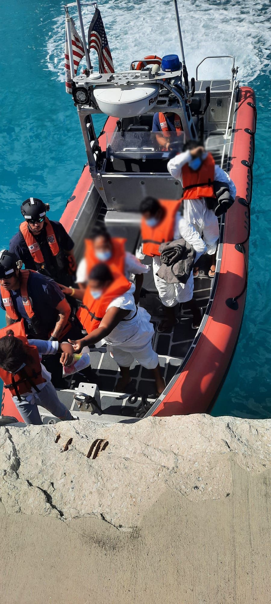 Coast Guard crew transfers people to the Bahamas