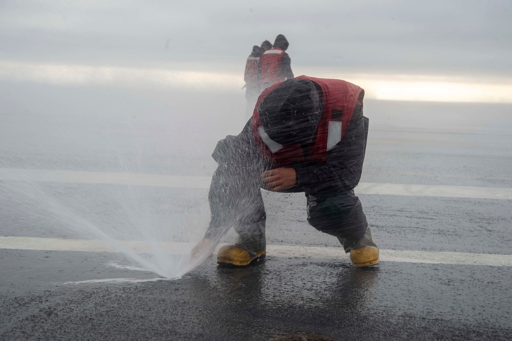 Sailor Clears Flight Deck Nozzle