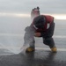 Sailor Clears Flight Deck Nozzle