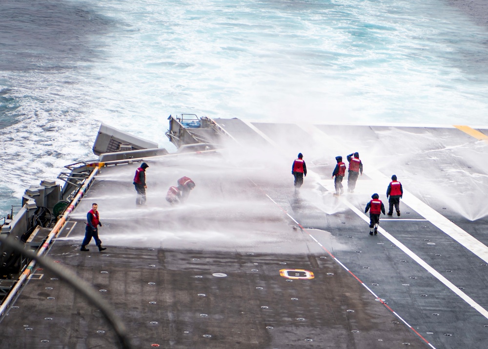 Sailors Participate In A Counter Measure Washdown