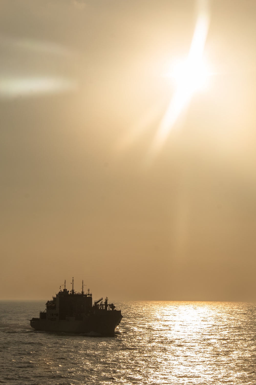 USS Ronald Reagan (CVN 76) conducts a replenishment-at-sea