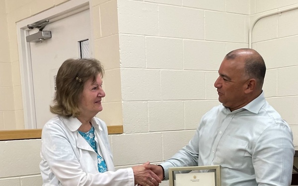 Assistant Secretary James D. Rodriguez Presents Nancy Smoyer with a Letter from Secretary of Labor Marty Walsh