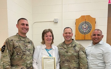 Assistant Secretary James D. Rodriguez Presents Nancy Smoyer with a Letter from Secretary of Labor Marty Walsh