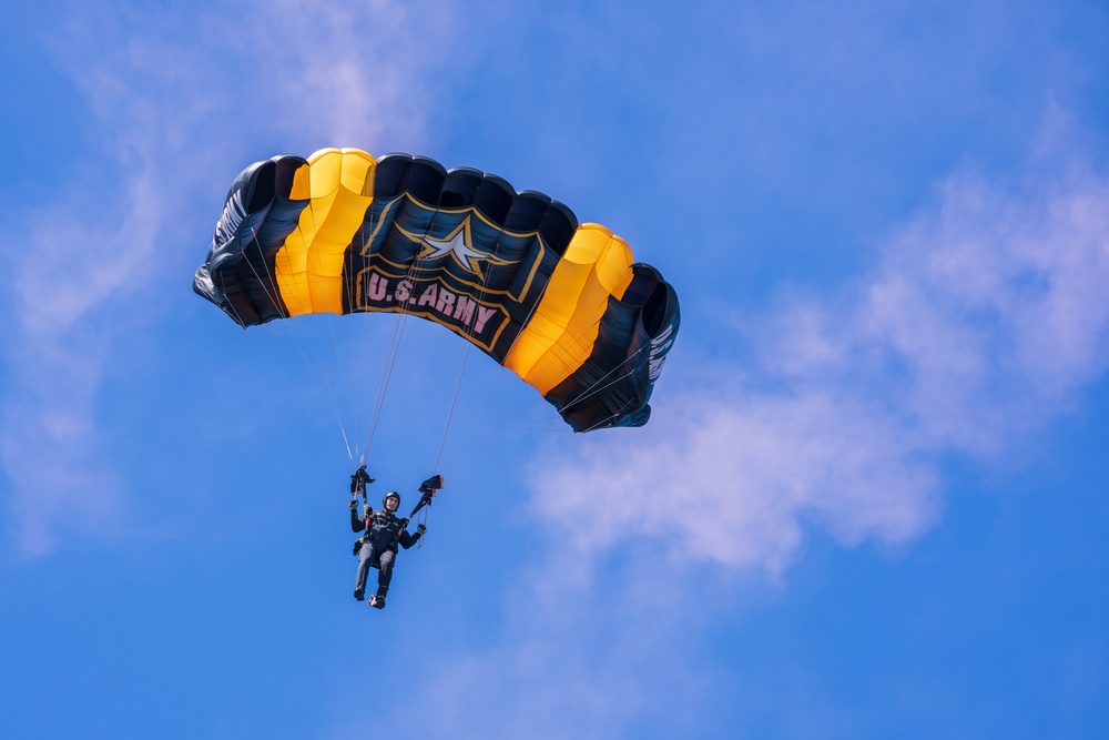 The U.S. Army Parachute Team jumps onto the USS Midway in San Diego