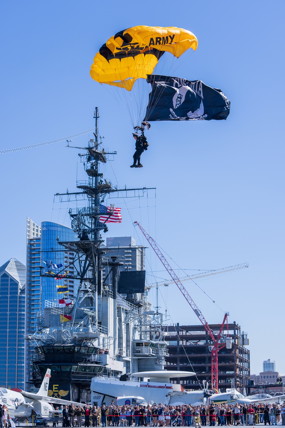 The U.S. Army Parachute Team jumps onto the USS Midway in San Diego