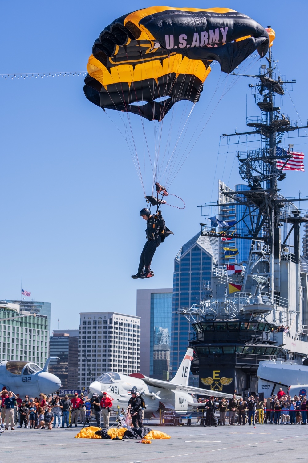 The U.S. Army Parachute Team jumps onto the USS Midway in San Diego